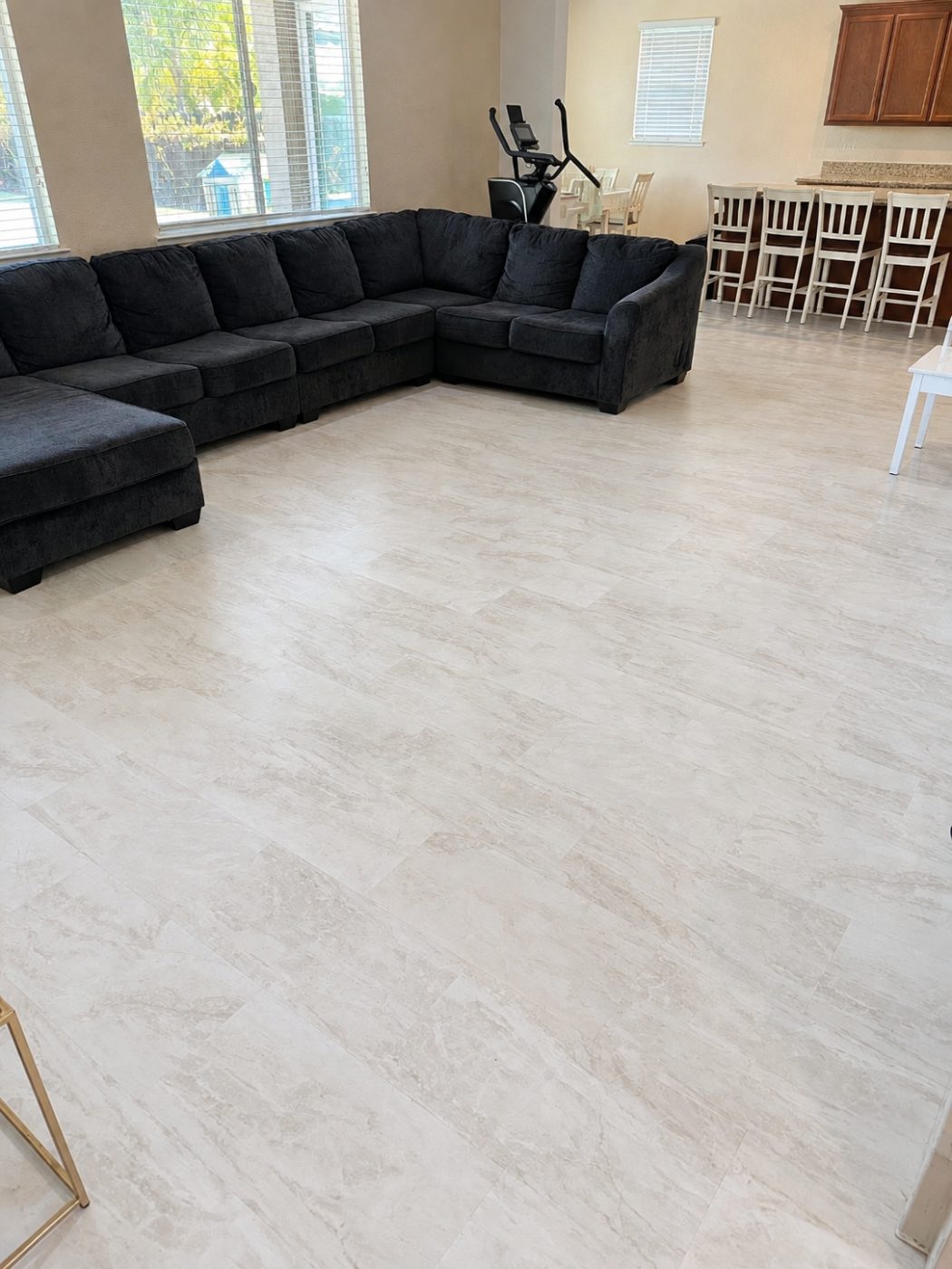 Large-format stone-look luxury vinyl plank in a living room